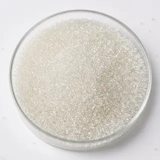 Styrene Gel White Beads resin beads in a laboratory petri dish